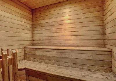 a wooden sauna with a wooden bench in it at Flying Dutchman 1109 by SummitCove Lodging in Keystone