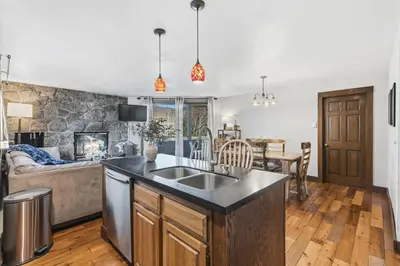 a kitchen and living room with a couch at 2BR Escape for 6 Overlooking Marina & Lake Dillon in Dillon