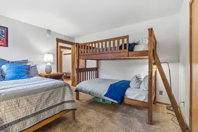a bedroom with two bunk beds at 2BR Escape for 6 Overlooking Marina & Lake Dillon in Dillon