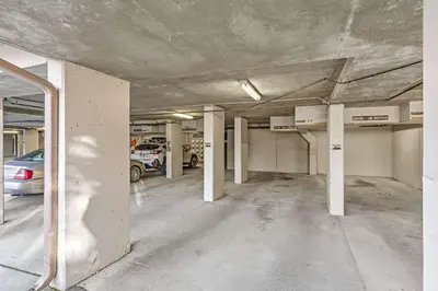 an empty parking garage with cars parked in it at 2BR Escape for 6 Overlooking Marina & Lake Dillon in Dillon