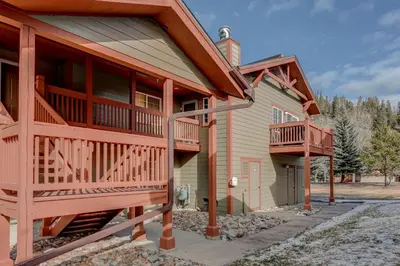 a home with a wrap around porch and a balcony at Breckenridge 2BR Ski and Mountain Adventure Base in Breckenridge