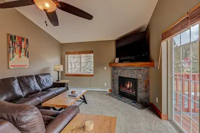 a living room with a couch and a fireplace at Breckenridge 2BR Ski and Mountain Adventure Base in Breckenridge