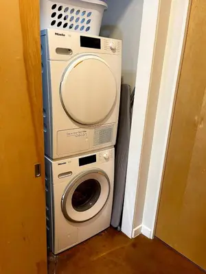 a washing machine and a dryer in a room at Beautiful Pearl Street condo! 30 DAY MINIMUM STAY in Boulder