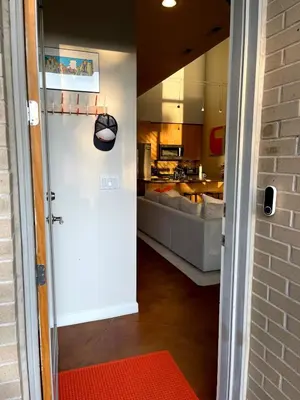 a door leading into a living room with a kitchen at Beautiful Pearl Street condo! 30 DAY MINIMUM STAY in Boulder