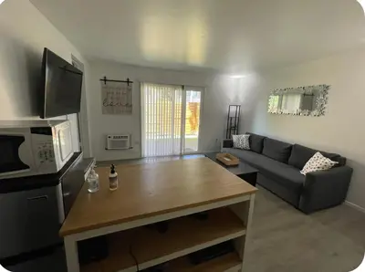 a living room with a couch and a table at My hidden gem in Denver