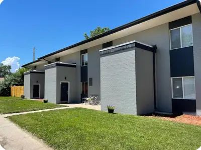 a building with a grass yard in front of it at My hidden gem in Denver