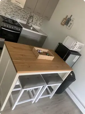 a kitchen with a wooden counter with a sink at My hidden gem in Denver