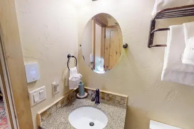 a bathroom with a sink and a mirror at Tenmile Mountain House in Frisco