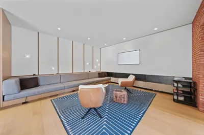 a living room with a couch and a chair at LoHi Luxury Modern House — Walk to Everywhere in Denver