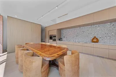 a dining room with a wooden table and chairs at LoHi Luxury Modern House — Walk to Everywhere in Denver