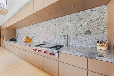 a kitchen with a stove and a counter top at LoHi Luxury Modern House — Walk to Everywhere in Denver