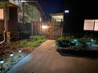 a house with lights on a driveway at night at Apartment in Ft Collins in Fort Collins