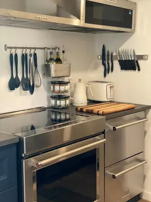 a kitchen with a stainless steel stove and utensils at Apartment in Ft Collins in Fort Collins