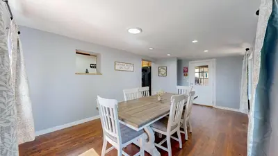 a dining room with a wooden table and chairs at Family Home in Arvada with king beds and bunkbed in Arvada
