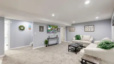 a living room with a couch and a table at Family Home in Arvada with king beds and bunkbed in Arvada