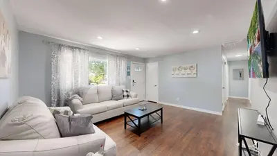 a living room with a white couch and a table at Family Home in Arvada with king beds and bunkbed in Arvada