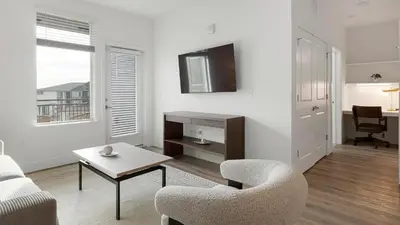 a living room with a couch and a chair and a table at Landing Incredible 2BD Clubhouse Gym in Longmont