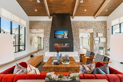 a living room with a red couch and a table at Landing Incredible 2BD Clubhouse Gym in Longmont
