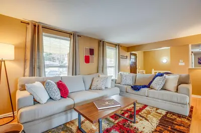 a living room with a couch and a coffee table at Gather Family! Home with Fenced Yard in Wheat Ridge in Wheat Ridge