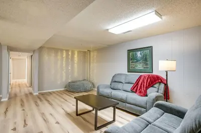 a living room with a couch and a table at Gather Family! Home with Fenced Yard in Wheat Ridge in Wheat Ridge