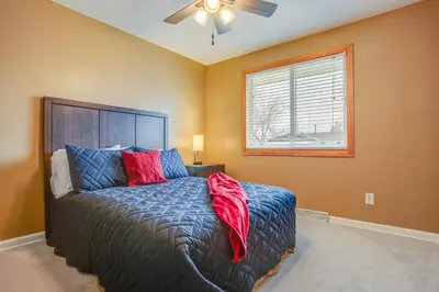 a bedroom with a bed and a ceiling fan at Gather Family! Home with Fenced Yard in Wheat Ridge in Wheat Ridge