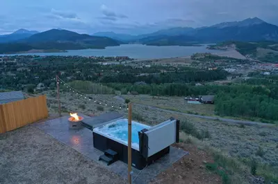 a hot tub on top of a hill with a fire at 10-Person HotTub, ViewHouse, Steps to Trail, Close to Ski Resorts, FirePit in Silverthorne