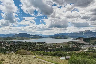 a view of a town and a lake with mountains at 10-Person HotTub, ViewHouse, Steps to Trail, Close to Ski Resorts, FirePit in Silverthorne