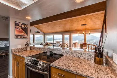 a kitchen with a stove and a counter top at 10-Person HotTub, ViewHouse, Steps to Trail, Close to Ski Resorts, FirePit in Silverthorne