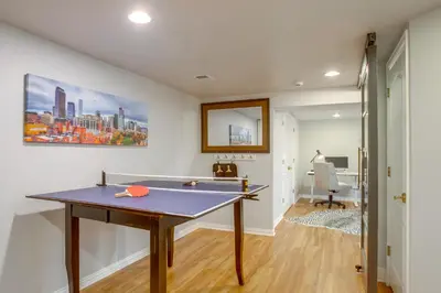 a room with a ping pong table in it at 9 Mi to Red Rocks Modern Getaway with Private Yard in Lakewood