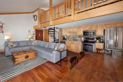 a living room with a couch and a table at Wild Irishman 2 bed 1 and half bath WIGK in Keystone