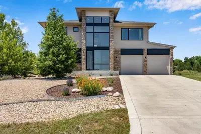 a house with a driveway in front of it at Perfectly Between Boulder- Estes in Longmont