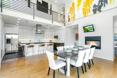 a kitchen and dining room with a table and chairs at Perfectly Between Boulder- Estes in Longmont