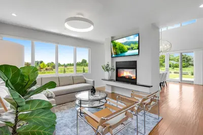 a living room with a couch and a tv at Perfectly Between Boulder- Estes in Longmont