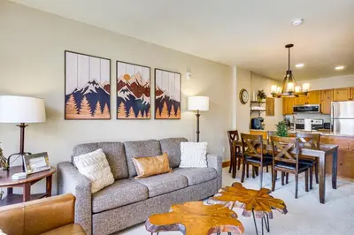 a living room with a couch and a dining room at Walk to Gondola! Keystone Gem in River Run Village in Keystone