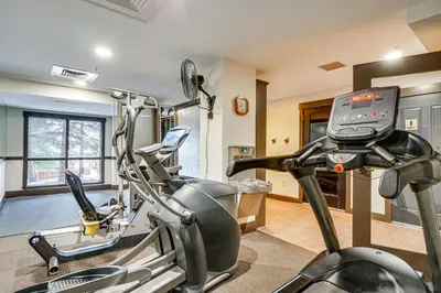 a fitness room with a treadmill and a gym at Walk to Gondola! Keystone Gem in River Run Village in Keystone
