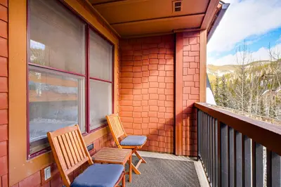 two chairs and a window on a balcony at Walk to Gondola! Keystone Gem in River Run Village in Keystone