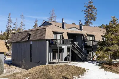 a large house with a gambrel roof at Comfortable Mountain Getaway near Winter Park in Fraser