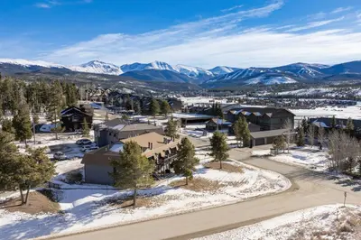 an aerial view of a resort with snow covered mountains at Comfortable Mountain Getaway near Winter Park in Fraser