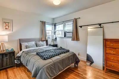 a bedroom with a bed and a dresser and a window at 7 Mi to Dtwn Denver Pet-Friendly Home with Yard in Aurora