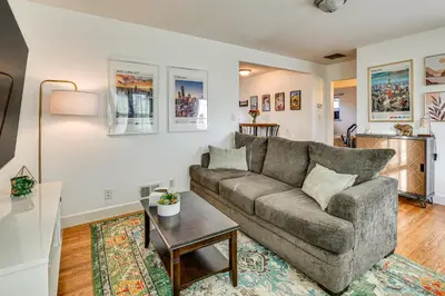 a living room with a couch and a table at 7 Mi to Dtwn Denver Pet-Friendly Home with Yard in Aurora