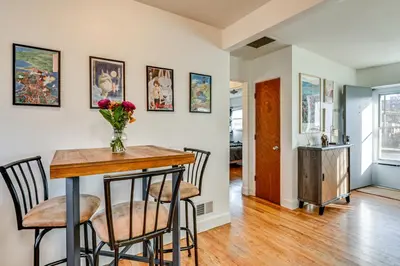 a kitchen and dining room with a table and chairs at 7 Mi to Dtwn Denver Pet-Friendly Home with Yard in Aurora