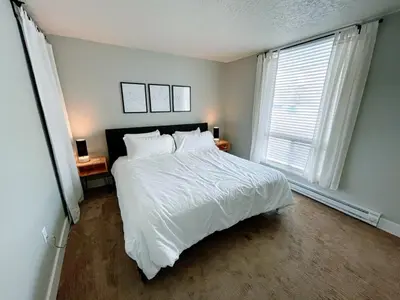 a bedroom with a white bed and a window at Spacious Dillon Basecamp, close to resorts! in Dillon