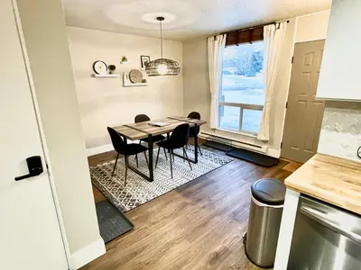 a kitchen and dining room with a table and chairs at Spacious Dillon Basecamp, close to resorts! in Dillon