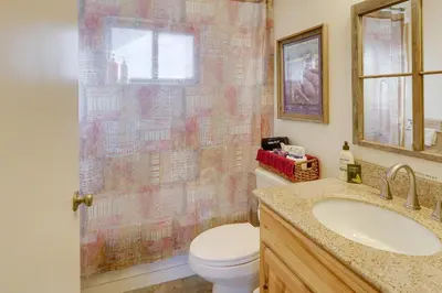 a bathroom with a toilet and a sink and a shower at 6 Mi to Dtwn Fort Collins Cozy Apt with Shared Yard in Fort Collins