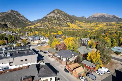 an aerial view of a town with mountains in the background at You Are My Sunshine - Downtown Frisco Home in Frisco