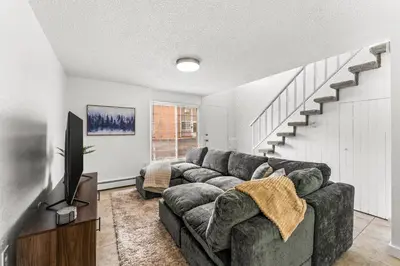 a living room with a couch and a television at Prime Location - Walking Distance to Old Town Arvada - 2 bedrooms 3 beds 1 bath in Arvada