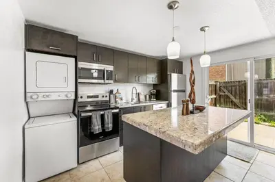 a kitchen with stainless steel appliances and a granite counter top at Prime Location - Walking Distance to Old Town Arvada - 2 bedrooms 3 beds 1 bath in Arvada