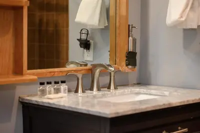 a bathroom counter with a sink and a mirror at Premium Unit 1100 - One Bedroom - Zephyr Mountain Lodge condo in Winter Park