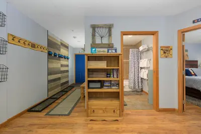 a room with a bed and a book shelf at Premium Unit 1100 - One Bedroom - Zephyr Mountain Lodge condo in Winter Park
