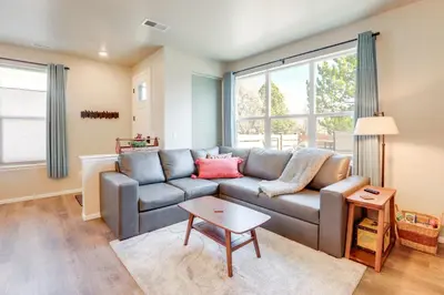 a living room with a couch and a table at Creekside Retreat Near Olde Town Arvada in Arvada